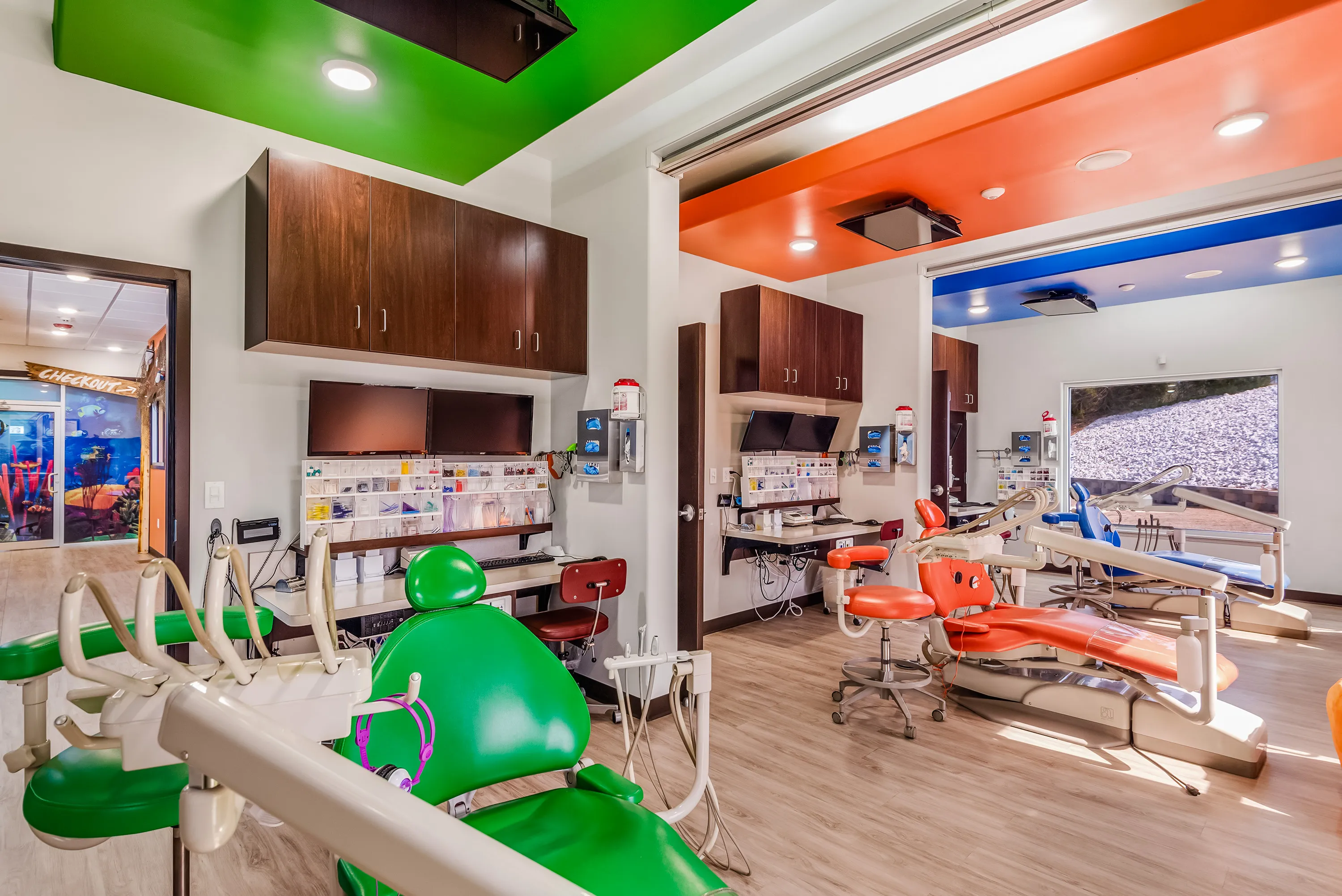 Operatory bays with brightly colored ceilings, green, orange, blue