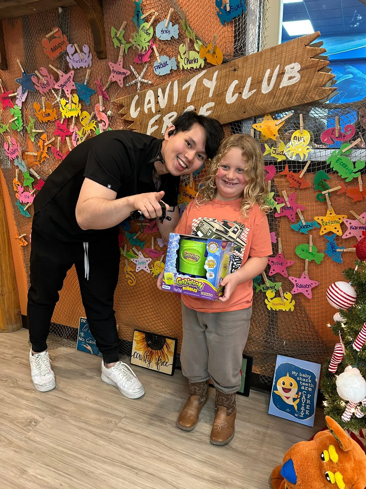 A young Cavity Free Club winner with their prize at Super Smiles